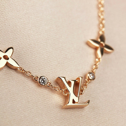 [AW]STAR AND SUN 7 MOTIFS GOLD BRACELET