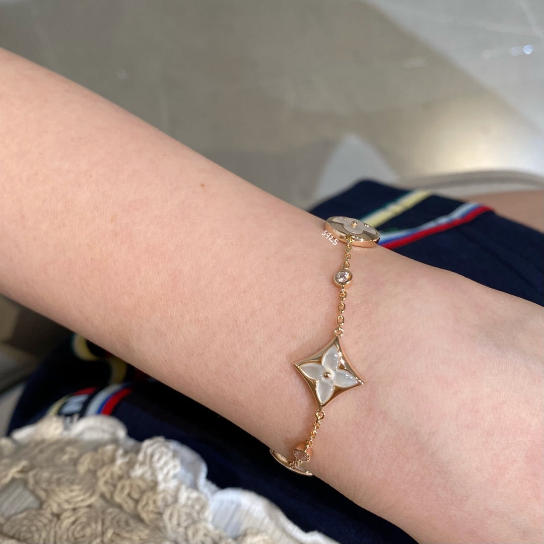 [AW]STAR AND SUN 4 MOTIF WHITE MOP ROSE GOLD BRACELET